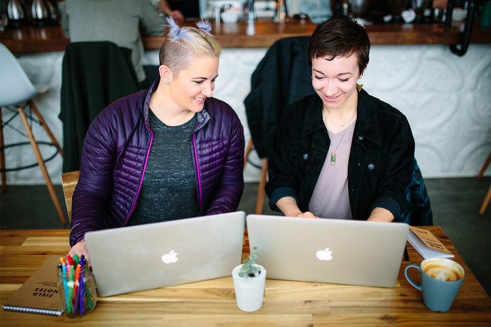 Wisetail LMS employees Juniper and Moriah work on the Wisetail LMS manifesto.