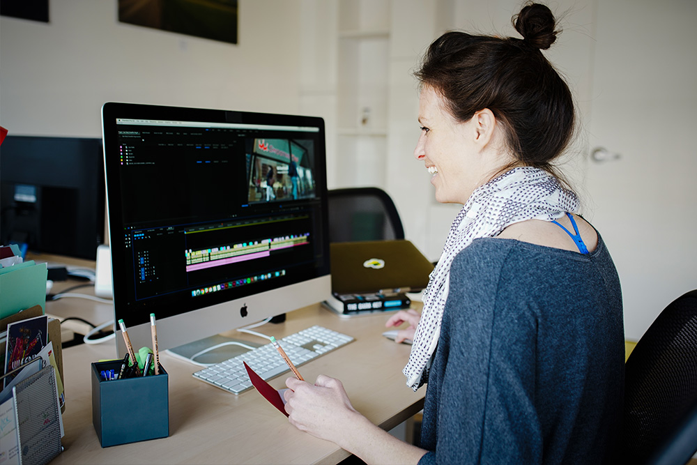 Wisetail LMS employee works on a video project.