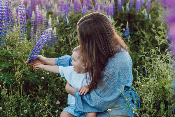 woman and baby in flowers