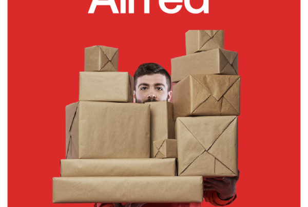 hello alfred's new logo, Alfred, above image of man holding multiple packages on red background