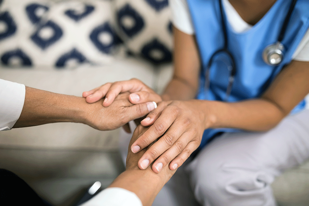 Nurse comforting patient