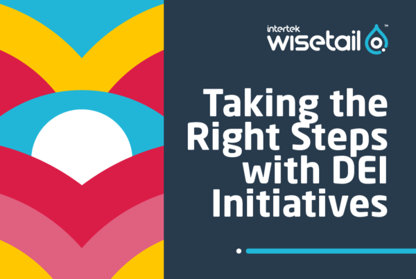 Geometric pattern with yellow, pink, red and teal rounded arrows pointing down and a white circle in the middle. Text on right side: "Taking the Right Steps with DEI initiatives"