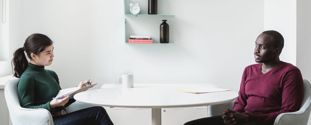 business people sitting at table for interview hiring
