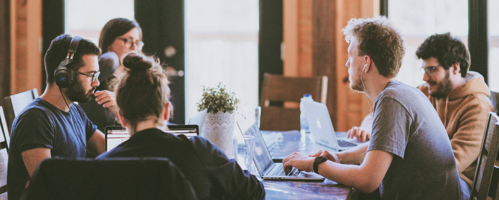 Group of people sitting down planning changes