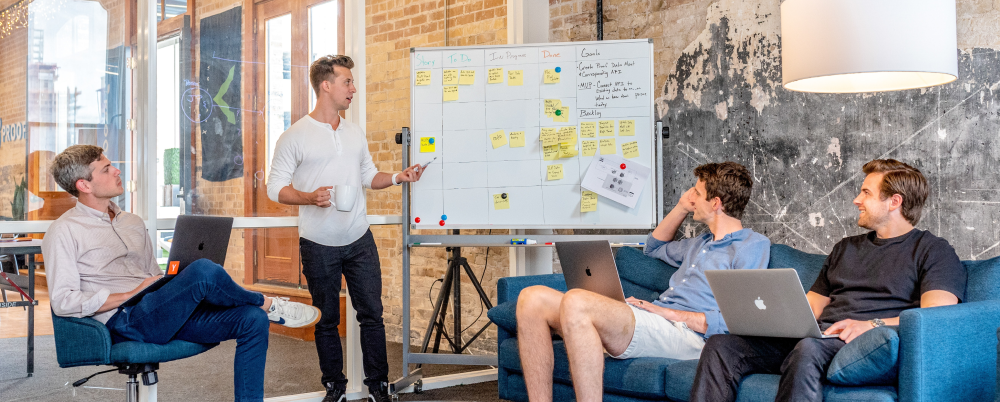 Group of employees evaluating core values, timeline, and goals