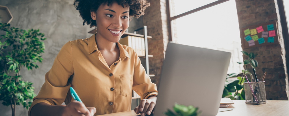 Woman creating checklists to help herself stay organized