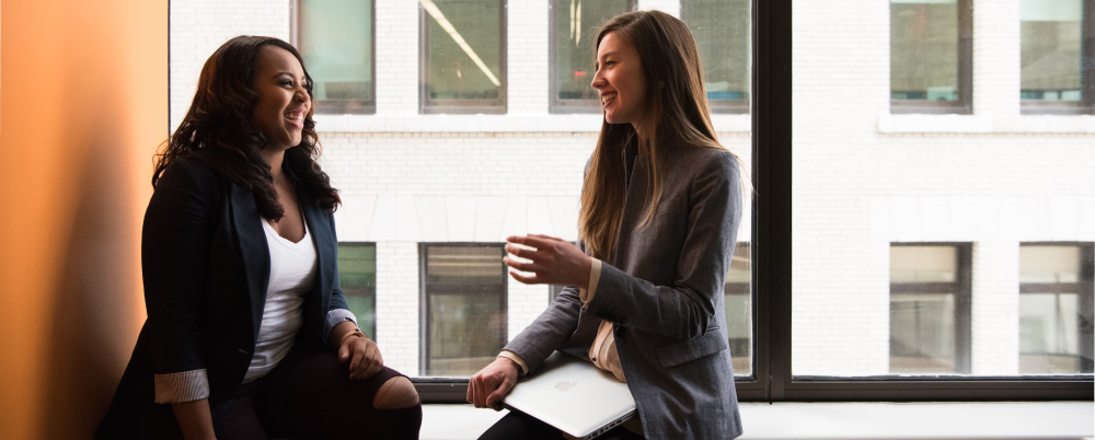 Two people giving each other advice in business