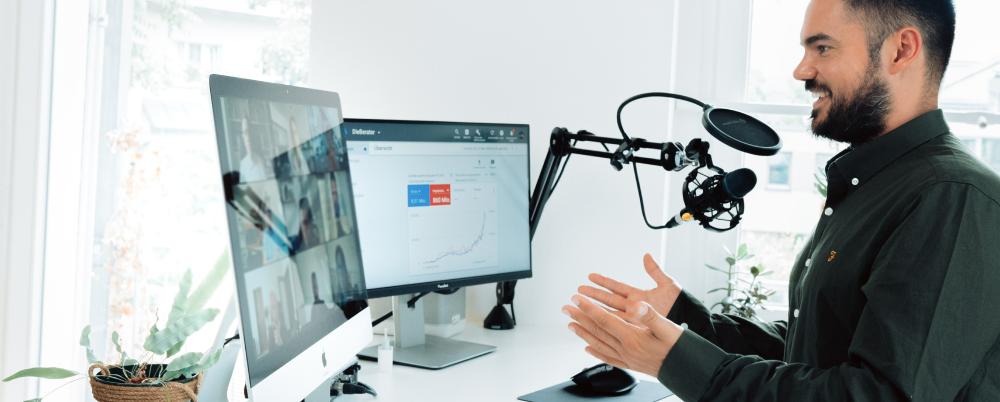 Employee collaborating with his team using modern technology