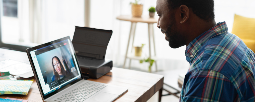 Man using technology to collaborate and create innovative solutions from a remote setting