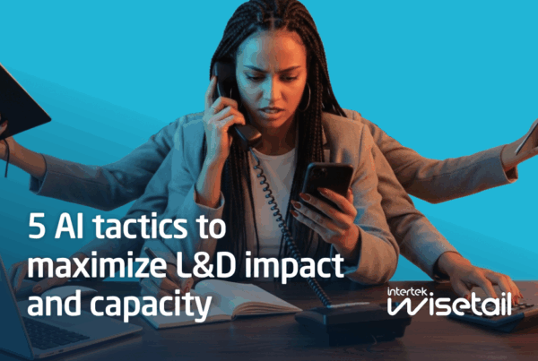 A businesswoman multitasks, holding a phone, book, and smartphone, with a laptop nearby. Text reads, “5 AI tactics to maximize L&D impact and capacity"