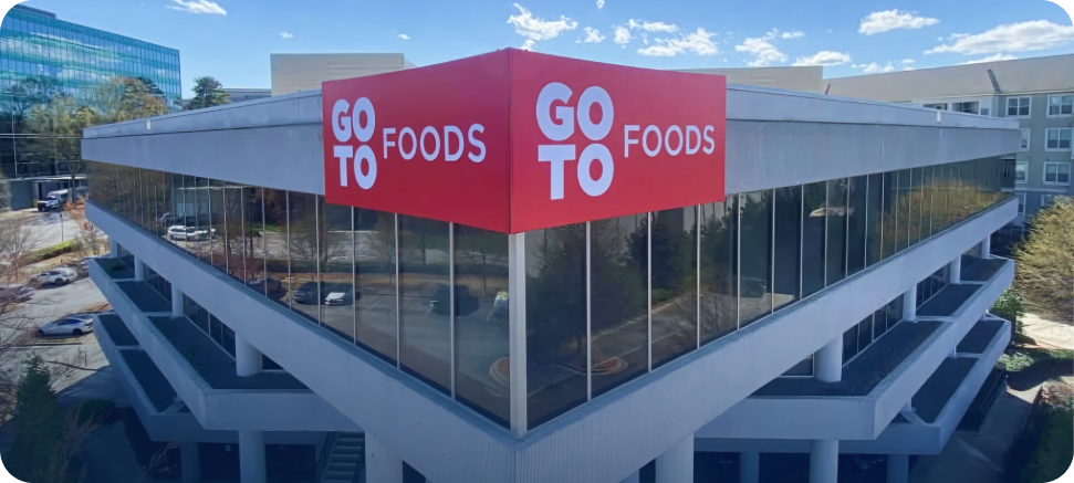 GoTo Foods logo displayed on corporate office building