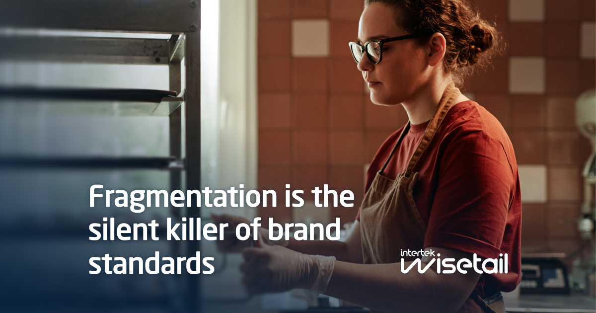 A woman in glasses and an apron works in a warm-toned kitchen. Text reads, "Fragmentation is the silent killer of brand standards." Mood is focused and contemplative.